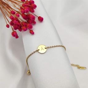 img 2 attached to Personalized Initial Bracelet for Women and Girls - 18K Gold Plated Stainless Steel Lettered Coin Charm with Delicate Disc Name - Glimmerst