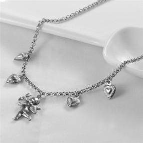 img 3 attached to 💖 Ожерелье на шейку Tiande Angel Cupid Chain - нержавеющая сталь с ангельским крылышком, сердцем любви и колокольчиком - ожерелье на клетку для женщин, девочек, мужчин и мальчиков.