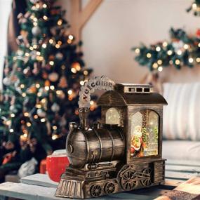 img 3 attached to Снежный глобус Санта-Клаус высотой 8.5 дюймов с музыкой - рождественское украшение с вихрящимися блестками для дома, гостиной - работает от батареи и USB (Поезд)