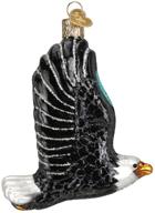 nature-inspired glass blown christmas tree ornaments: old world christmas bird watcher collection - majestic eagle in flight logo