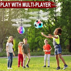 img 3 attached to 🎁 2-Pack RC Flying Ball Glow Toys for Kids - Holiday Xmas Gifts, RC Mini Drones Hand Controlled Helicopter with 2 Remote Controllers, Quadcopter Christmas Stocking Stuffers Toy for Boys and Girls