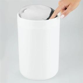 img 1 attached to mDesign Small Round Plastic Trash Can Wastebasket with Swing Top Lid - for Bathrooms, Kitchens, Home Offices - 1.3 Gallon/5 Liter - White/Chrome