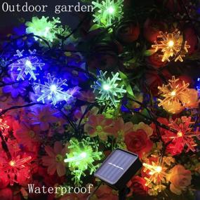 img 1 attached to 🎄 31ft 50LEDs Waterproof Snowflake Solar Christmas Lights for Parties, Garden, Outdoor, Holiday, Patio, Christmas Tree Decoration - Mankinlu Multicolor Snowflake String Lights