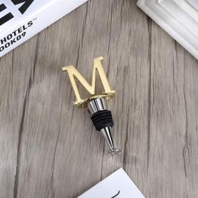 img 1 attached to 🍾 Wine and Beverage Bottle Stopper with Gold Finish - Ideal Gift for Valentine's Day, Mother's Day, Father's Day, Thanksgiving (Letter M)