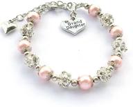 dolon gift for granddaughter: rhinestone ball and faux pearl bracelet jewelry logo