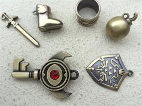 img 1 attached to The Ultimate Collection Series: Legend of Zelda Twilight Princess, Hylian Shield & Master Sword Keychain, Necklace & Jewelry Sets