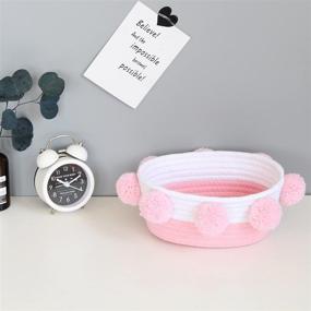 img 3 attached to 🎀 Oval Pink Cotton Rope Storage Basket with Pompoms - Handmade Woven, 10.6&#34; x 9.8&#34; x 4.3&#34; - Cute Baby Basket for Books, Pet Toys, Gifts, Desktop Shelf Organizer