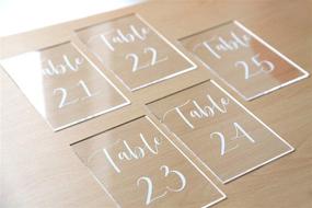 img 1 attached to 📋 UNIQOOO Acrylic Wedding Table Numbers 21-25 with Stands, Clear Calligraphy Signs and Holders - Perfect for Reception Decor, Centerpieces, Events and Parties