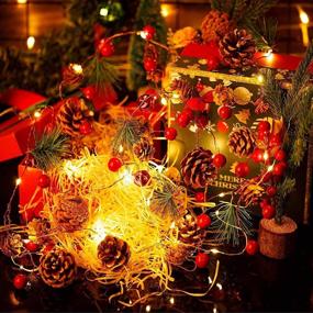 img 4 attached to 🎄 Christmas Garland with Lights: 30 LED Pinecone Lights, 10ft Battery Operated with Red Berries and Bells - Indoor Outdoor Fairy Twinkle Lights for Winter Holiday, Xmas Tree, New Year Festival, Party Decor