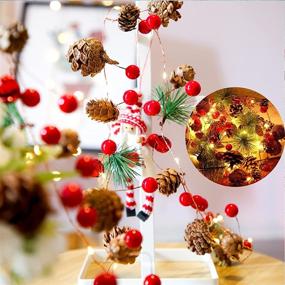 img 1 attached to 🎄 Christmas Garland with Lights: 30 LED Pinecone Lights, 10ft Battery Operated with Red Berries and Bells - Indoor Outdoor Fairy Twinkle Lights for Winter Holiday, Xmas Tree, New Year Festival, Party Decor