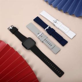 img 1 attached to 📱 CAVN 4-Pack Sport Bands Compatible with Fitbit Versa 2/Versa/Versa Lite - Silicone Bands for Women Men - Replacement Wristband Watch Straps - Black/Grey/White/Navy Blue - Size S (5.5''-7.9'')