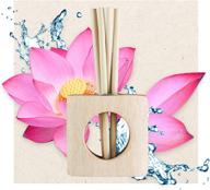 🌿 экологиченстный ароматизатор enviroscent non-toxic scented stix diffuser: набор освежителя воздуха spring water + lotus (4 предмета) с эфирными маслами + подставка из мангового дерева и 2 заполнения для ароматизаторов scent stix. логотип