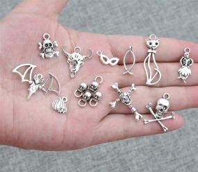 img 3 attached to 🎃 Yansanido 100pcs Mixed Skulls Masks Halloween Charms Pendants - Craft Supplies Charms for Jewelry Making and Crafting - Antique Silver Halloween Collection - DIY Charms (100 pcs Mixed Skull Silver)