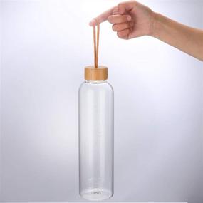 img 1 attached to 🍃 32 Oz Glass Water Bottle with Silicone Sleeve, Time Marker, Leakproof Bamboo Lid - Ideal for Travel, Gym, and Home - BPA Free (Black)