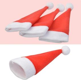 img 1 attached to Marrywindix 50pcs Silverware Holders: Festive Christmas Santa Hats for Xmas Party Dinner, Utensil Organizers and Decorations