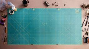 img 1 attached to OLFA 35x70 Inch Connecting Grid Rotary Cutting Mat Set - Self Healing Double Sided Cutting Mat with Grid for Fabric & Sewing, Designed for Use with Rotary Cutters (Green)