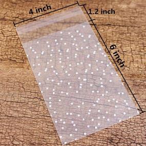img 2 attached to 🛍️ 200 PCS LiyuanQ Self Adhesive Candy Bag | Cellophane Cookie Bags | Self-adhesive Sealing Cellophane Bags | White Polka Dot Clear Bags | OPP Plastic Party Bag | 4 x 6 Inches | Ideal for Bakery, Candy, Soap