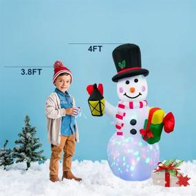 img 1 attached to 🎅 HueLiv 4FT Inflatable Christmas Decorations for Yard - Xmas Outdoor Snowman Blow Up Decor with Colorful Rotating LED Lights for Indoor Lawn Garden Holiday Décor