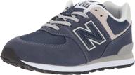 new balance kid's 574 v1 evergreen lace-up sneaker: classic style and comfort for active kids logo