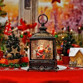 img 2 attached to 🎁 Christmas Snow Globe Lantern with Timer, Battery & USB Power: Swirling Glitter Snow Globe Lantern for Holiday Home Decor (Santa Claus and Gifts)