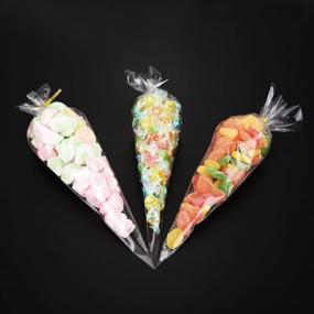 img 1 attached to 🎁 GOETOR Cone Bag Set of 100: Clear Cello Treat Bags, 14.57 by 7 Inch Triangle Goody Bags with Twist Ties for Favors, Christmas, Popcorn, Candies, Handmade