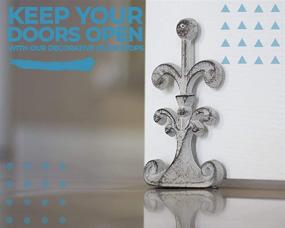 img 3 attached to 🚪 Fleur De Lis Cast Iron Door Stop - Vintage Design, Decorative Door Stopper Wedge with Padded Anti-Scratch Felt Bottom - 4x3.5x7.5