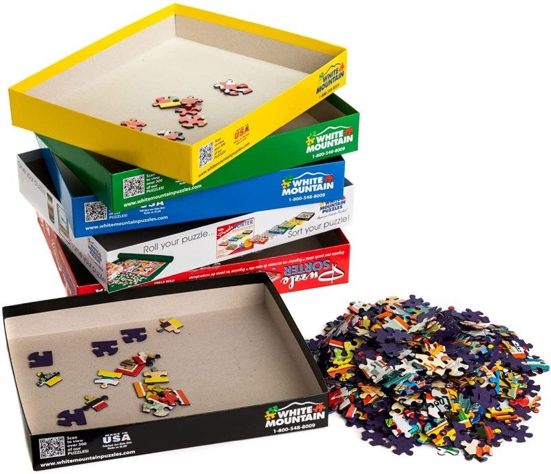 white mountain puzzles puzzle mystery 로고