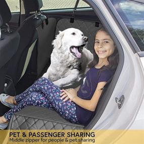 img 2 attached to Durable Dog Car Backseat Cover with Large Side Flaps - Full Protection for Car/SUV Doors, Backseat & Floor - Waterproof, Non-slip, Washable - Includes Bonus Lint Roller & Dog Seat Belt by TrioGato