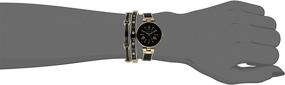 img 1 attached to 🌟 Anne Klein Women's Premium Crystal Accent Gold-Tone and Black Bangle Watch Set, AK/3374BKST