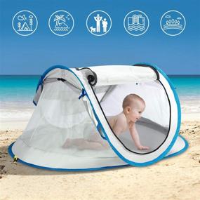 img 2 attached to 🏖️ FITNATE Portable Baby Beach Tent, Infant & Toddler Travel Bed, UPF 50+ Sun Shelter with Moisture-Proof Pad, Pop Up Design with Storage Bag and 2 Pegs - Perfect for Beach, Grass, and Indoor Use