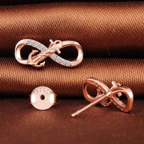 img 2 attached to 💎 Infinity Silver Winding Earrings for Girls - Timeless Jewelry