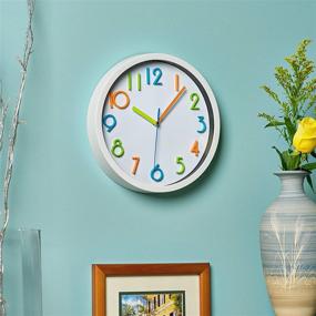 img 1 attached to 🕒 Bernhard Products Colorful 10 Inch Kids Wall Clock - Silent Non Ticking Quartz Battery Operated Clock, Easy to Read 3D Multi Colored Numbers for Nursery, Classroom, Office, and Kitchen - White Frame