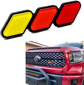 img 4 attached to iJDMTOY Retro 3-Color Stripe Grille Badge Emblem with Toggle Anchor Bolts, No Removal Needed, Compatible with Toyota Tacoma Tundra 4Runner FJ Cruiser RAV4 Hilux, etc - Yellow/Orange/Red