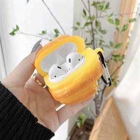 img 2 attached to Чехол TYOROY для AirPods в форме круассана - стильный трехмерный мягкий чехол с карабином для девочек, мальчиков, подростков и женщин - совместим с AirPods 1 и 2.