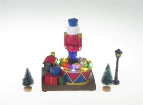 img 2 attached to Lightahead LED Lighted Turning Nutcracker Soldier: Musical Christmas Scene Decoration with 8 Melodies Tabletop Centerpieces