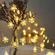 🎄 merdeco snowflake string lights – 33ft/10m, 100 led warm white fairy lights for christmas, wedding, party indoor and outdoor decoration – plug-in string lights logo