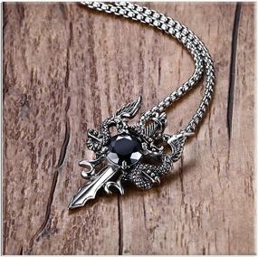 img 1 attached to 🐉 Xusamss Punk Wing Dragon Crystal Pendant Sword Necklace with 24in Link Chain - Titanium Steel