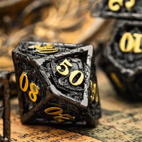 img 1 attached to 🐉 UDIXI 7 Metal Dice Set - Polyhedral Dungeons and Dragons Dice for RPGs, Dragon-themed DND Dice Set for D&D, MTG, Pathfinder (Shield Dragon Black Golden)