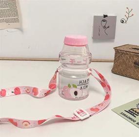 img 3 attached to 🍑 Yakult Shape Milk Carton Shaker Bottle for Kids/Girls - Cute Kawaii Design, Includes Matching Straps - 480ml Capacity - Peach (Clear)