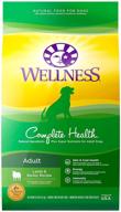 🐶 wellness complete health lamb & barley dry dog food with grains - natural, healthy recipe for adult dogs, made in usa, with added vitamins and minerals, no meat by-products, fillers, or artificial preservatives logo