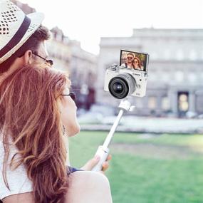 img 2 attached to 📷 Mini Portable Camera Tripod: Lightweight White Handle for iPhone/Samsung/Google Smartphone, Action Cam, Webcam - 1/4" Vlogging Table Stand for Video Shooting & Photography Accessory