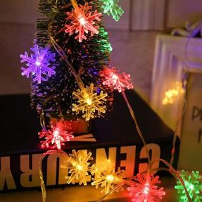 img 1 attached to 🎄 Darknessbreak Solar Christmas Lights: 30ft 50 LED Multi-Color Snowflake String Lights for Outdoor Xmas Decor, Tree, Fire Place, Play House, Kids Tent, Bedroom