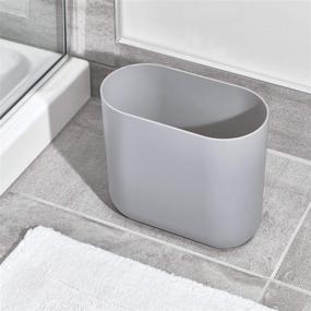 img 2 attached to Efficiently Organize Your Space with the iDesign Cade Oval Slim Trash: A Compact Waste Basket for Bathroom, Bedroom, Home Office, Dorm, College in Matte Gray