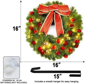 img 3 attached to Premium 16 Inch Large Prelit Christmas Wreath with LED Lights, Festive Red Bow, and 32 Colored Balls - Battery Operated Xmas Decorations for Front Door - Indoor/Outdoor Home Décor - Includes 15” Wreath Hanger