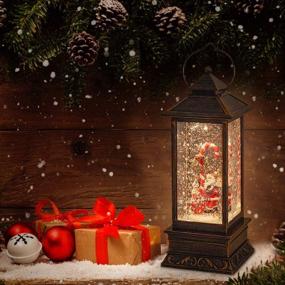img 1 attached to 🎅 Christmas Musical Snow Globe Lantern: Spinning Glittering, 6-Hour Timer, USB & Battery Operated - Santa Claus and Candy Cane - Best Christmas Decorations and Gifts