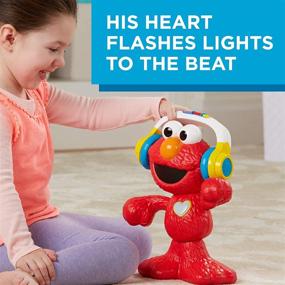 img 1 attached to Sesame Street Давайте танцевать Элмо: 12-дюймовая игрушка, поющая и танцующая, с 3 музыкальными режимами для детей от 18 месяцев и старше