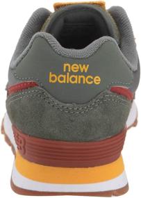 img 2 attached to 👟 Stylish and Sturdy: New Balance Kids' 574 V1 Camp Lace-up Sneaker