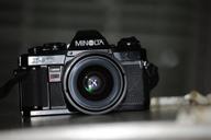 minolta x-570 slr 📸 camera bundle featuring 50mm f/1.7 lens logo