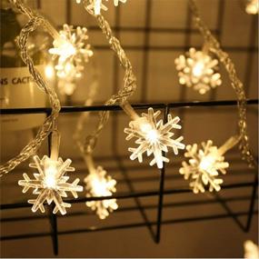 img 2 attached to 🎄 Merdeco Snowflake String Lights - 16ft/5m 50 LED Warm White Fairy Lights for Christmas, Wedding, Party - Indoor & Outdoor Decor