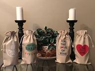 pack of 4 holiday wine bags, perfect for gift-giving! логотип